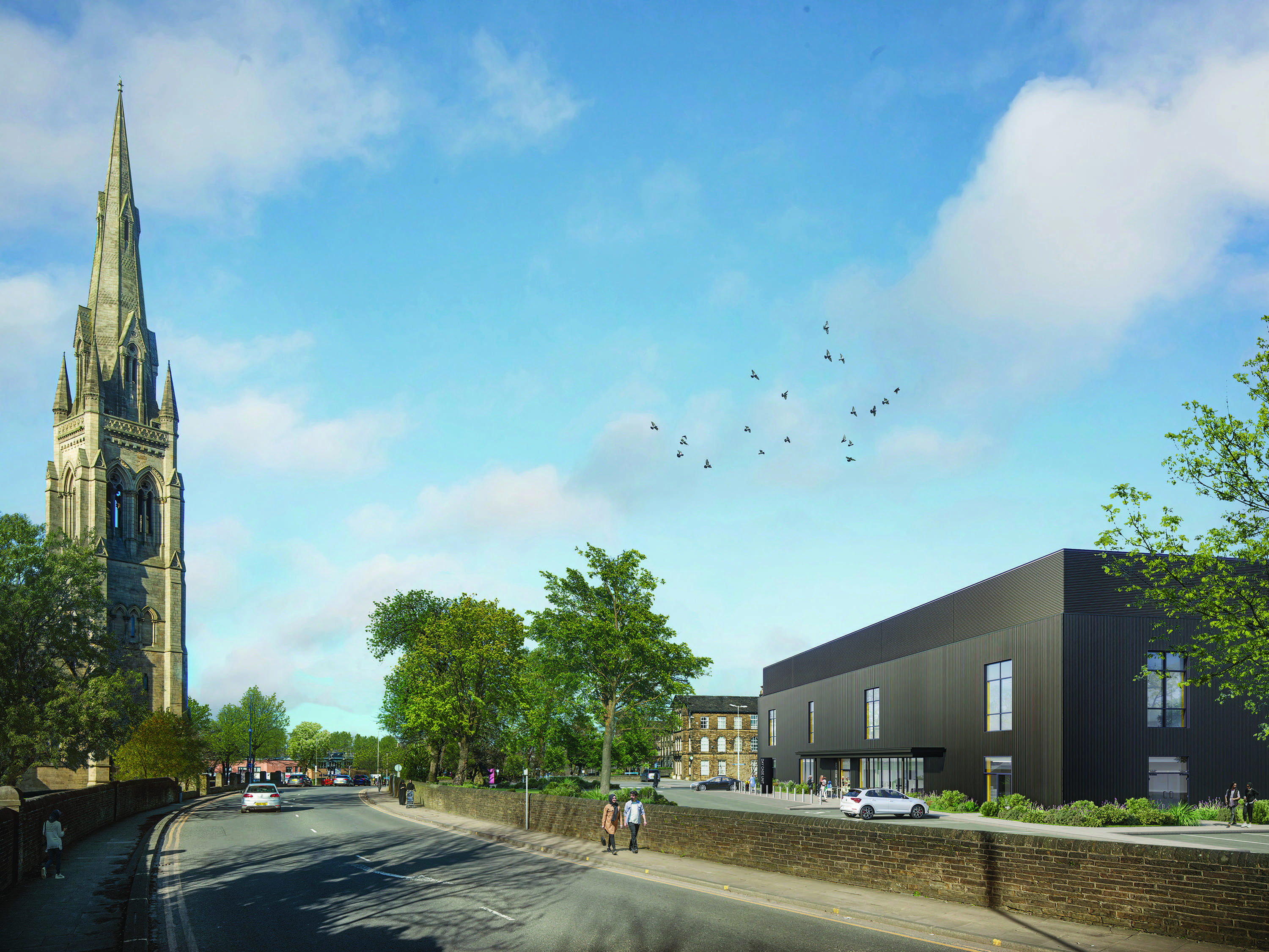 Architectural render of the external design of the new day case unit, viewed from an angle across the street. The building is finished with ribbed, dark grey cladding and there are large windows on both floors. The main entrance features a large glass area and a wide canopy. On the opposite side of the street there is a church. There are a number of mature trees on either side of the street.